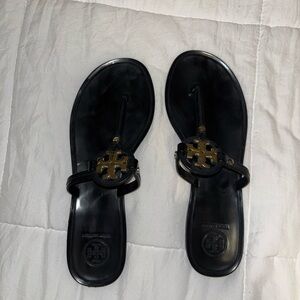 Tory Burch Black Flip Flops with Gold Emblem